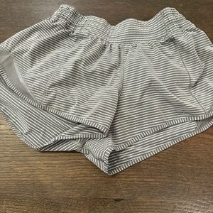 Lululemon women’s hottie hot shorts. Size 6. Gray with white stripe. High-rise.